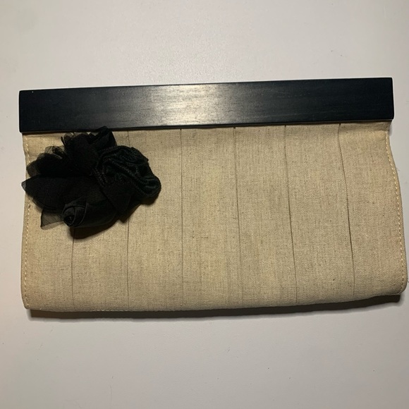 The Limited Handbags - The Limited brand tan clutch with black flower enhancement, magnetic closure NWT
